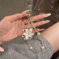 LUXE LINE Lily Flower Beaded Phone Charm Wrist Strap